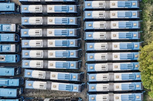 Free Top-down aerial view of neatly parked blue buses, South Tangerang. Stock Photo