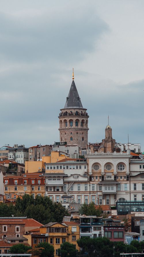 Free Historic Galata Tower stands above the vibrant urban landscape of Istanbul. Stock Photo