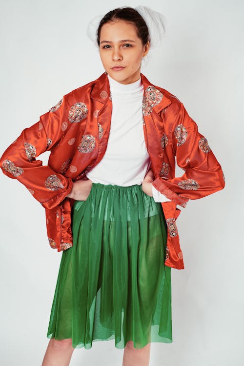 Woman in White Crew-neck Shirt and Green Skirt Standing in Room