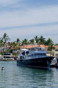 Elegant yacht docked at Puerto Vallarta harbor, showcasing tropical luxury and travel.