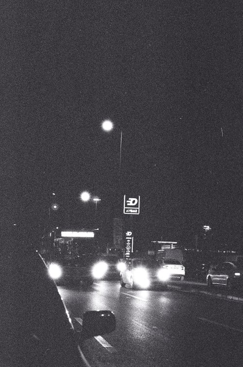 Free Black and white street view of Ankara at night with traffic lights and cars. Stock Photo