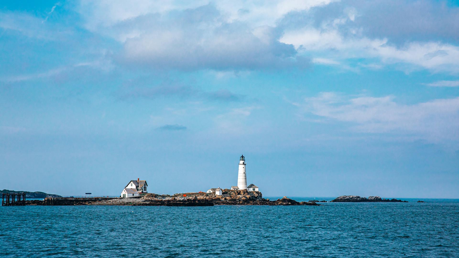 Small Island with Boston Lighthouse and Houses in Massachusetts in USA