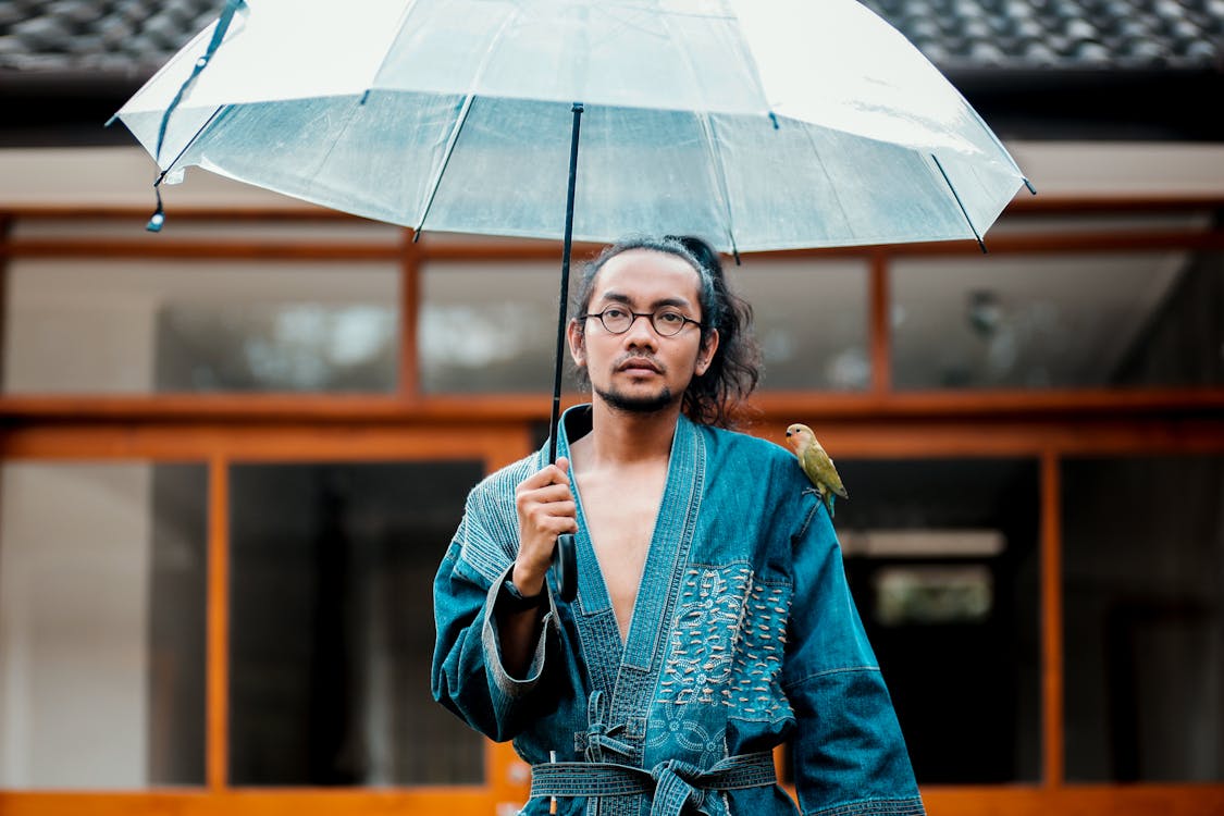 Free Man Holding Umbrella Stock Photo
