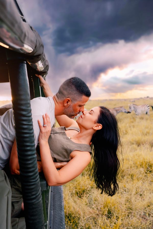 Couple at safari camp sundowner