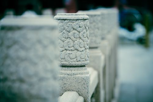 Free Close-up of an intricately carved stone column with abstract patterns, showcasing architectural detail. Stock Photo