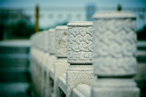 Free Intricate stone pillars with decorative carvings in a row, showcasing selective focus. Stock Photo