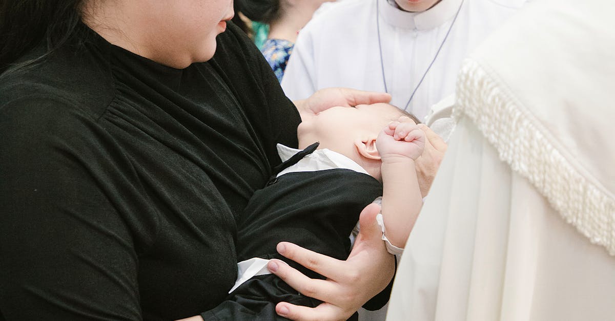 A woman holding a baby in a church