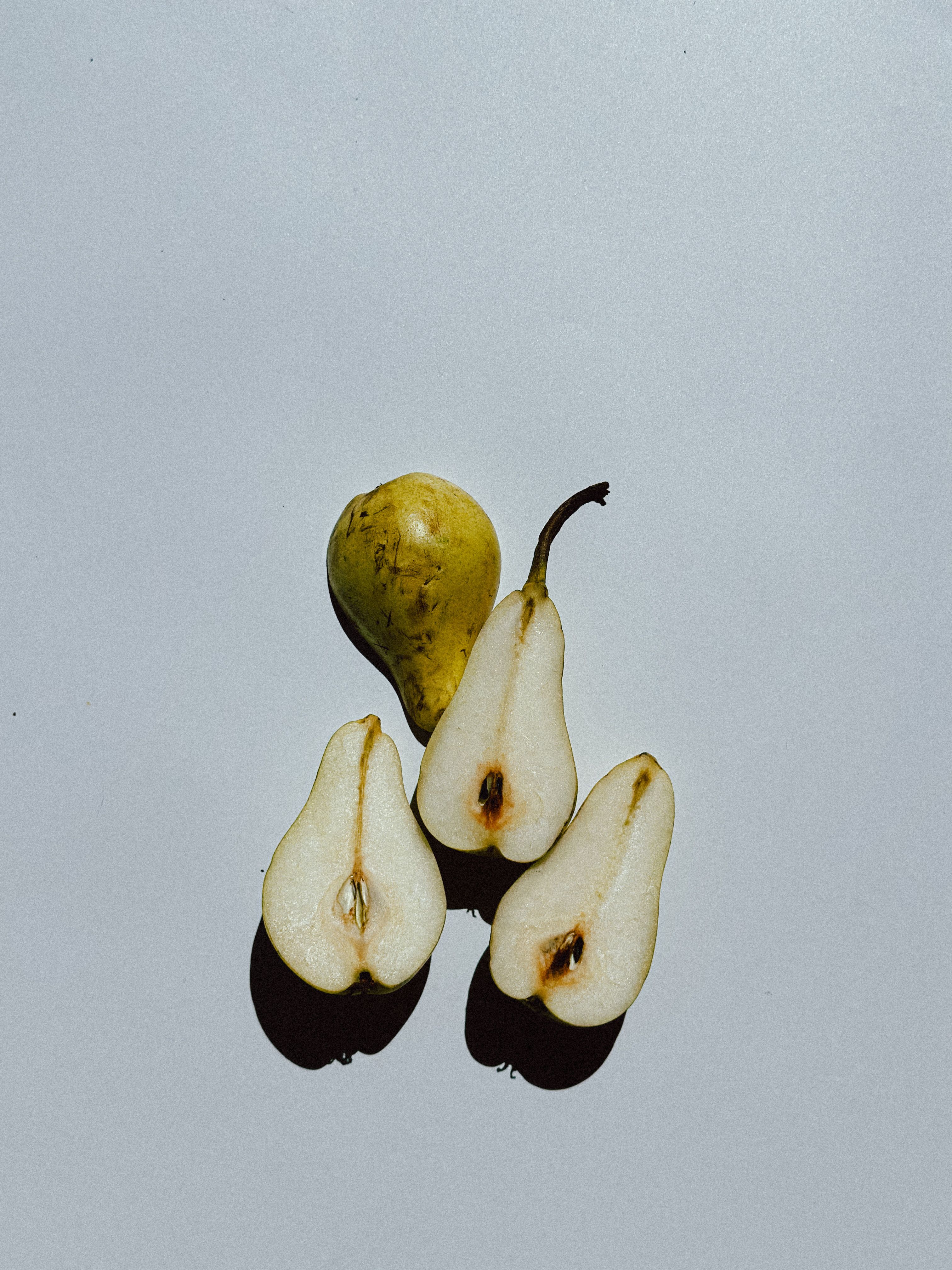 Pears Lying on White Surface · Free Stock Photo