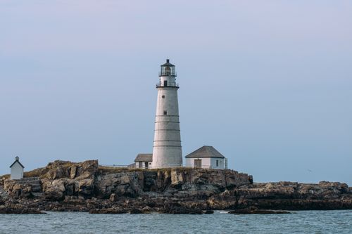 Free Scenic view of the iconic Boston Light Lighthouse on Little Brewster Island, a historic landmark in Massachusetts. Stock Photo