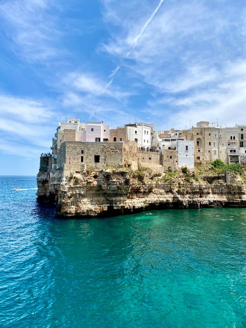 Free Stunning view of historic buildings perched on cliffs at Polignano a Mare, Italy. Stock Photo