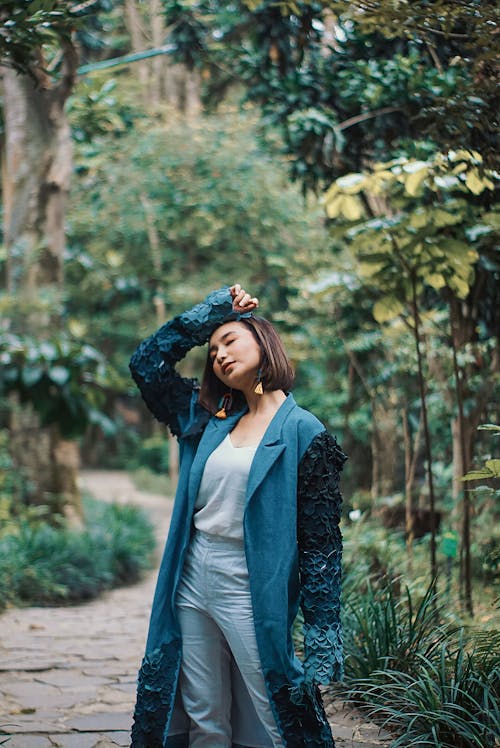 Free Standing Woman With Her Right Hand on Her Head Stock Photo