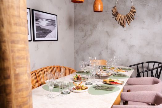 Warm and inviting dining area featuring a stylish table setting with an assortment of delicious dishes.