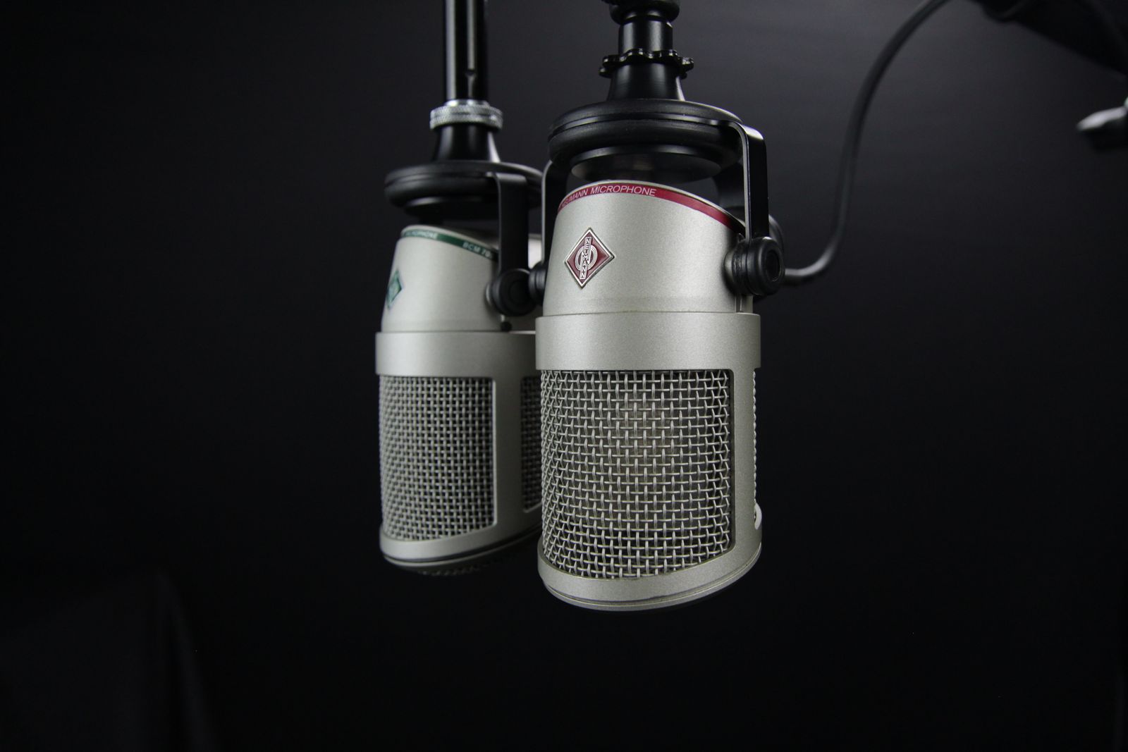 Two professional microphones in a recording studio, ideal for podcasts