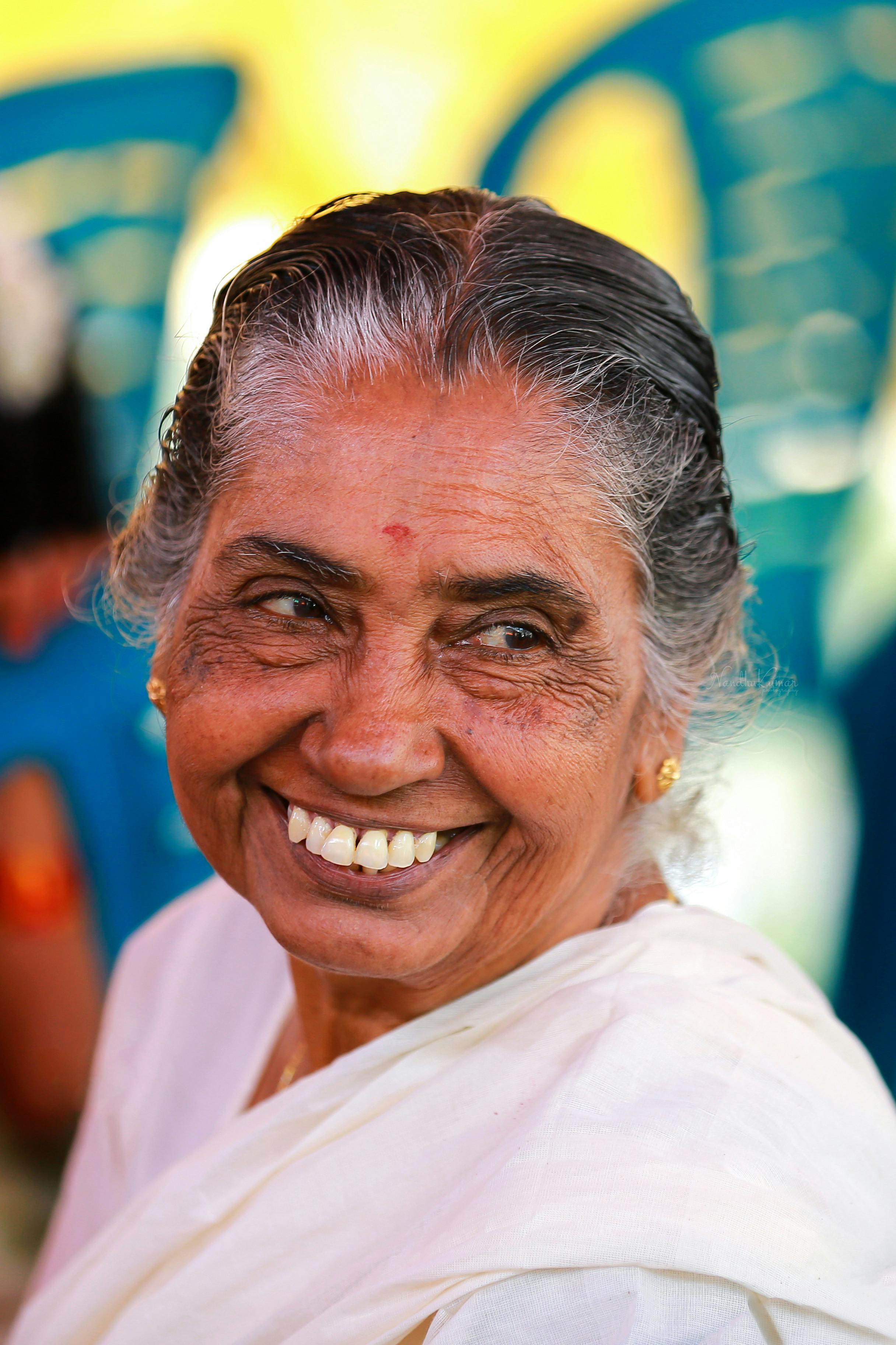 smiling woman in white dress