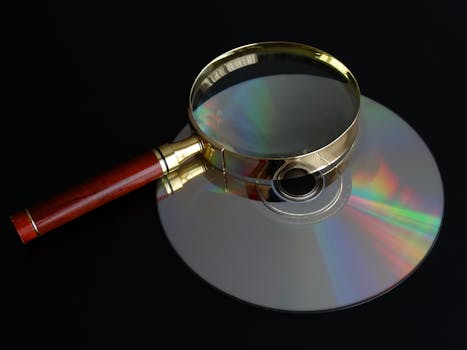Free stock photo of disc, magnifying glass, cd