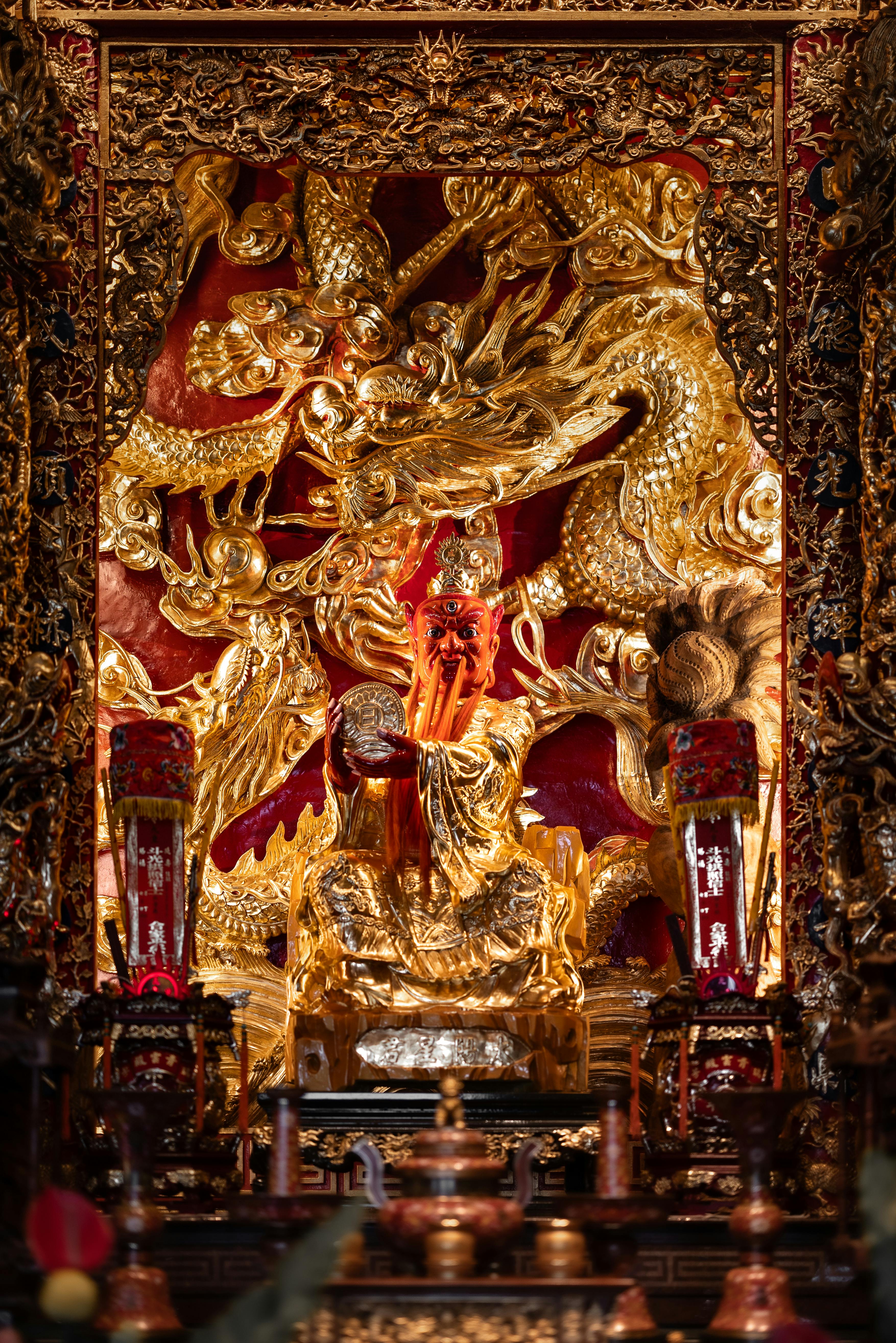 gold ornate statue and a dragon in a chinese temple