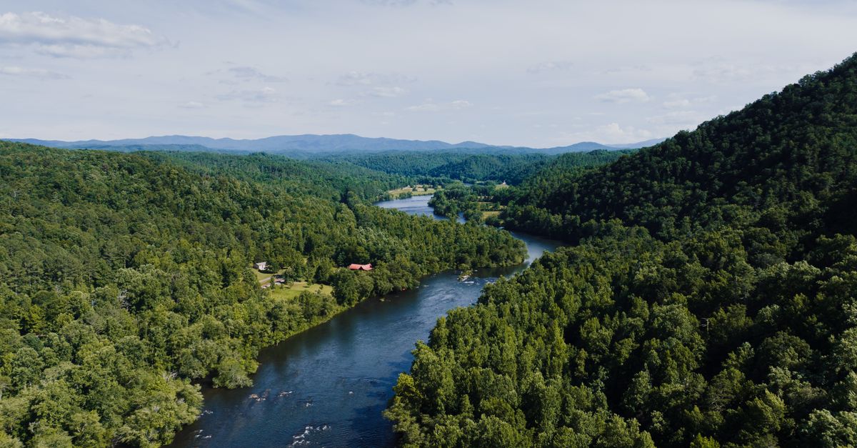 Scenic view of a river winding through the lush hills of Tennessee.