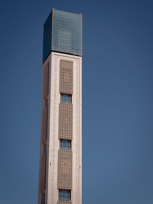 Free A towering modern structure photographed against a clear blue sky, showcasing minimalist architecture. Stock Photo
