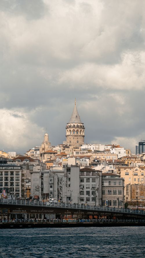 Free Scenic view of Galata Tower rising above Istanbul's historic urban setting. Stock Photo