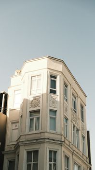 Elegant urban architecture showcasing intricate facade design in daylight.