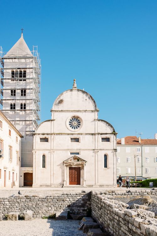 Free A scenic view of St. Mary's Church in Zadar under a clear blue sky. Perfect for travel and architecture themes. Stock Photo