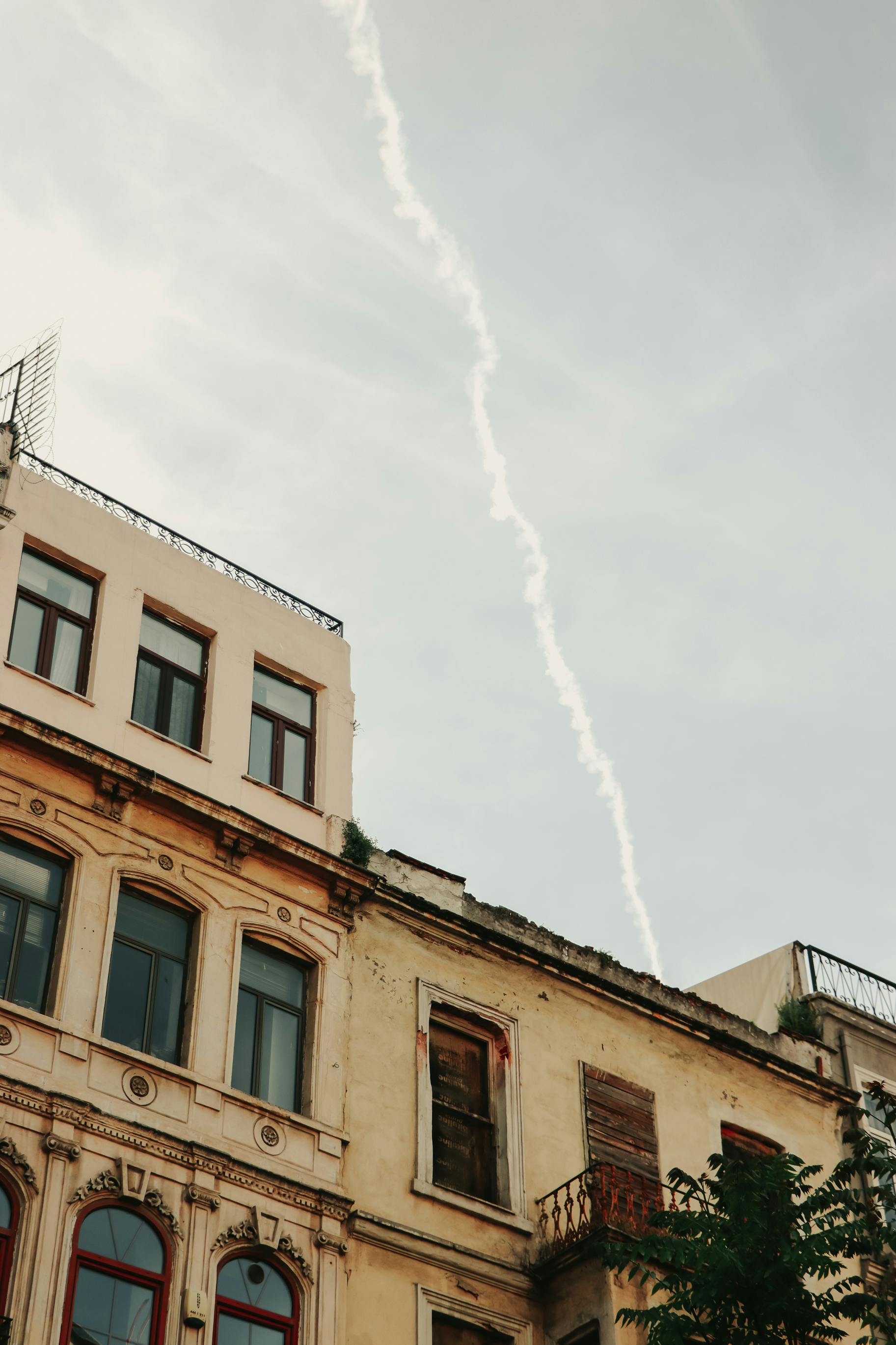 a building with a cloud in the sky above it