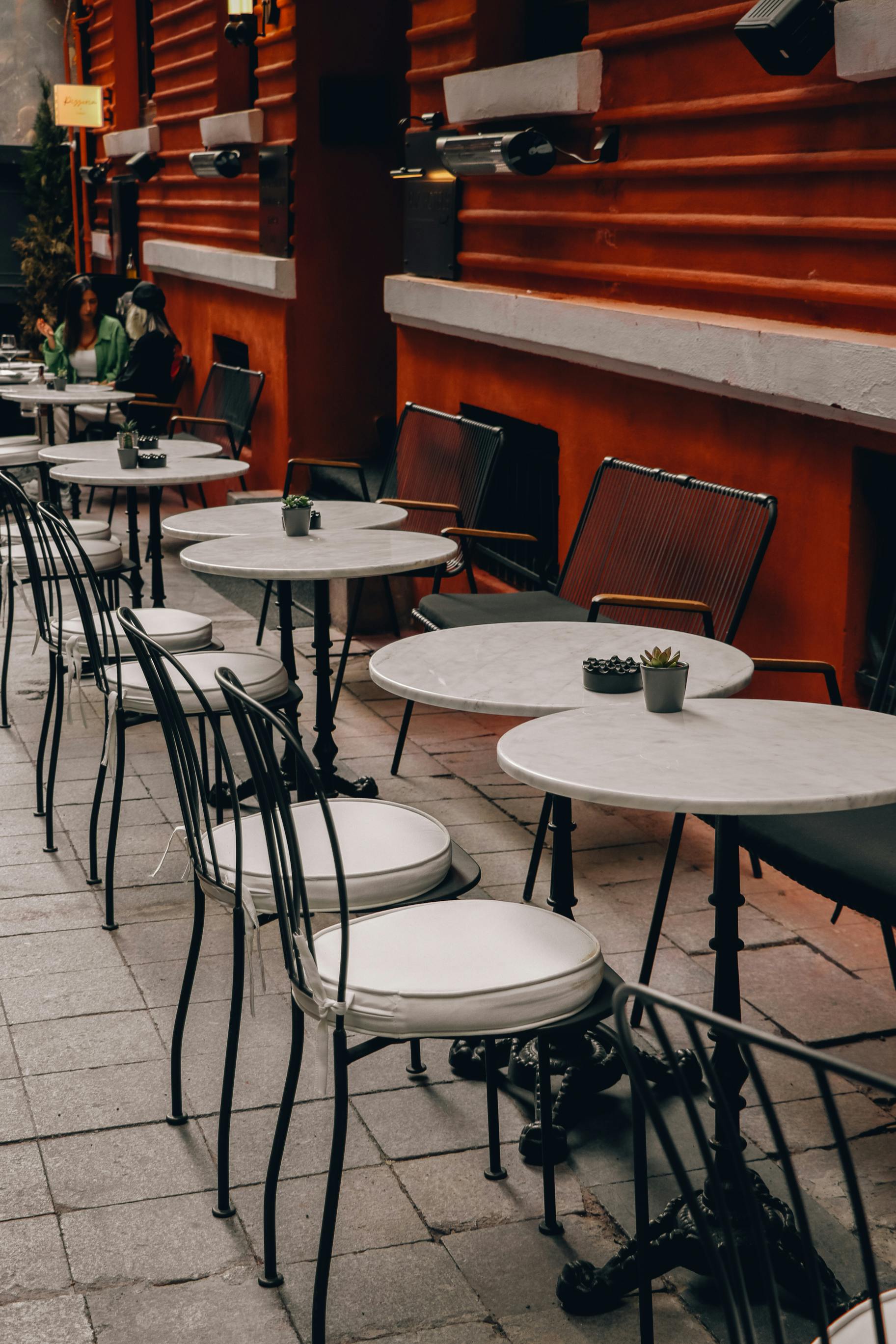 a restaurant with tables and chairs outside