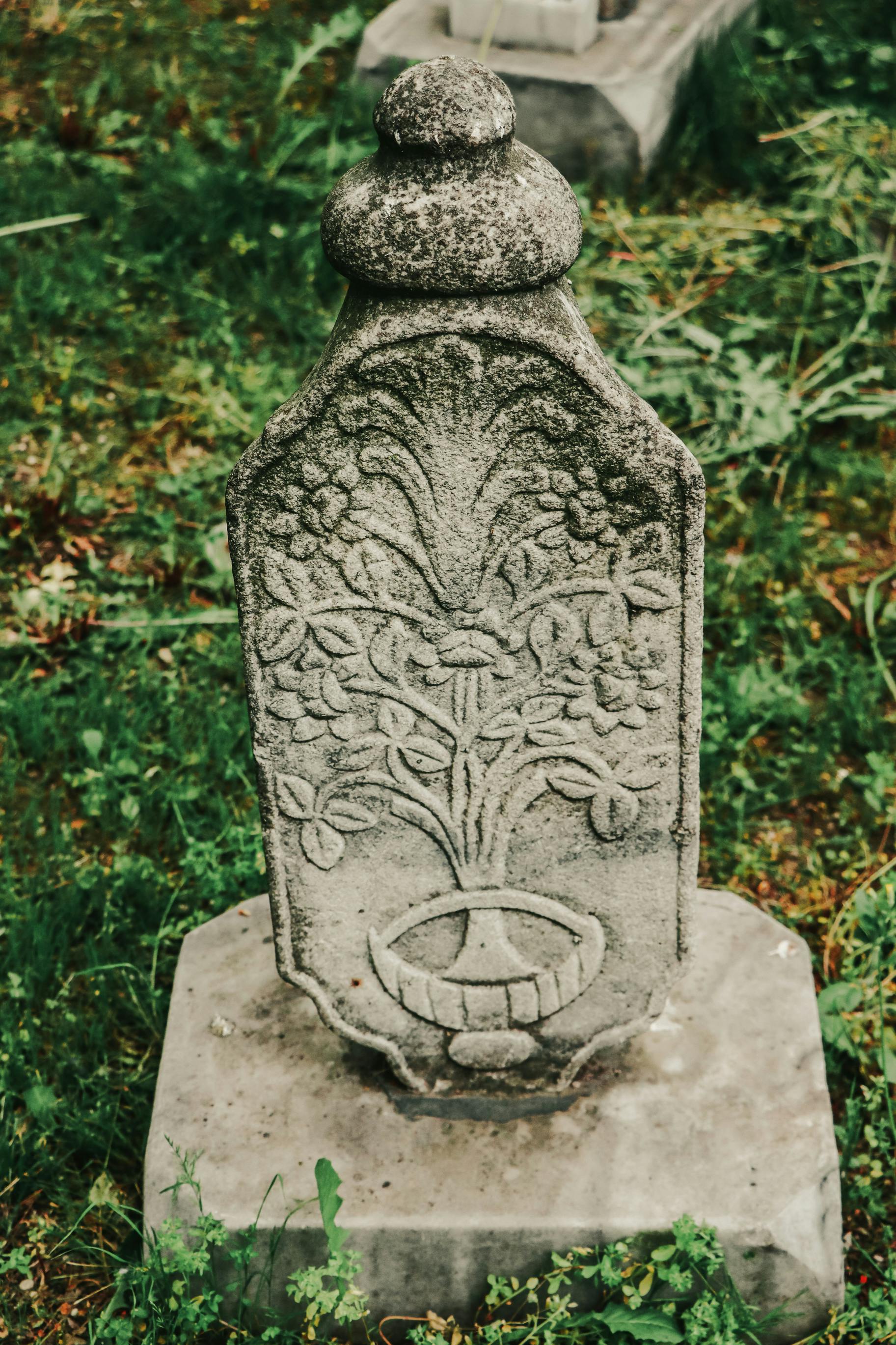 a stone with a carved tree on it