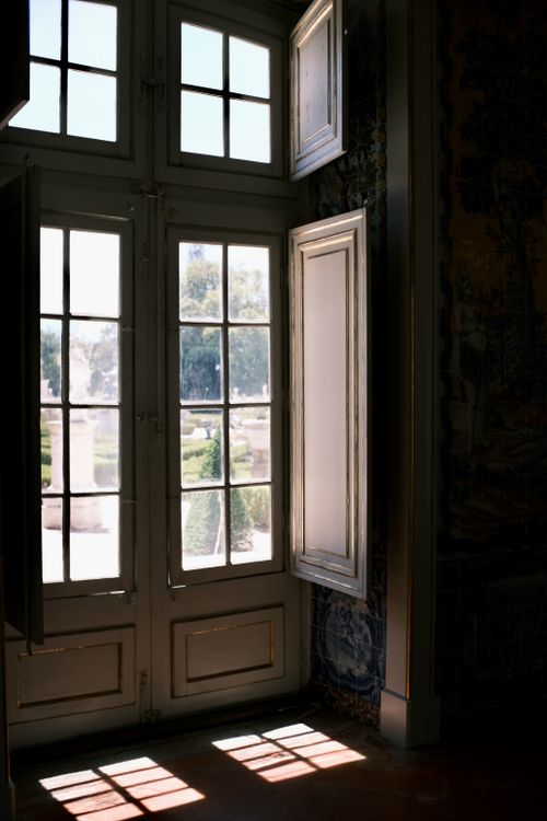 Free Elegant sunlight streams through a window in the historic Queluz Palace, Portugal. Stock Photo