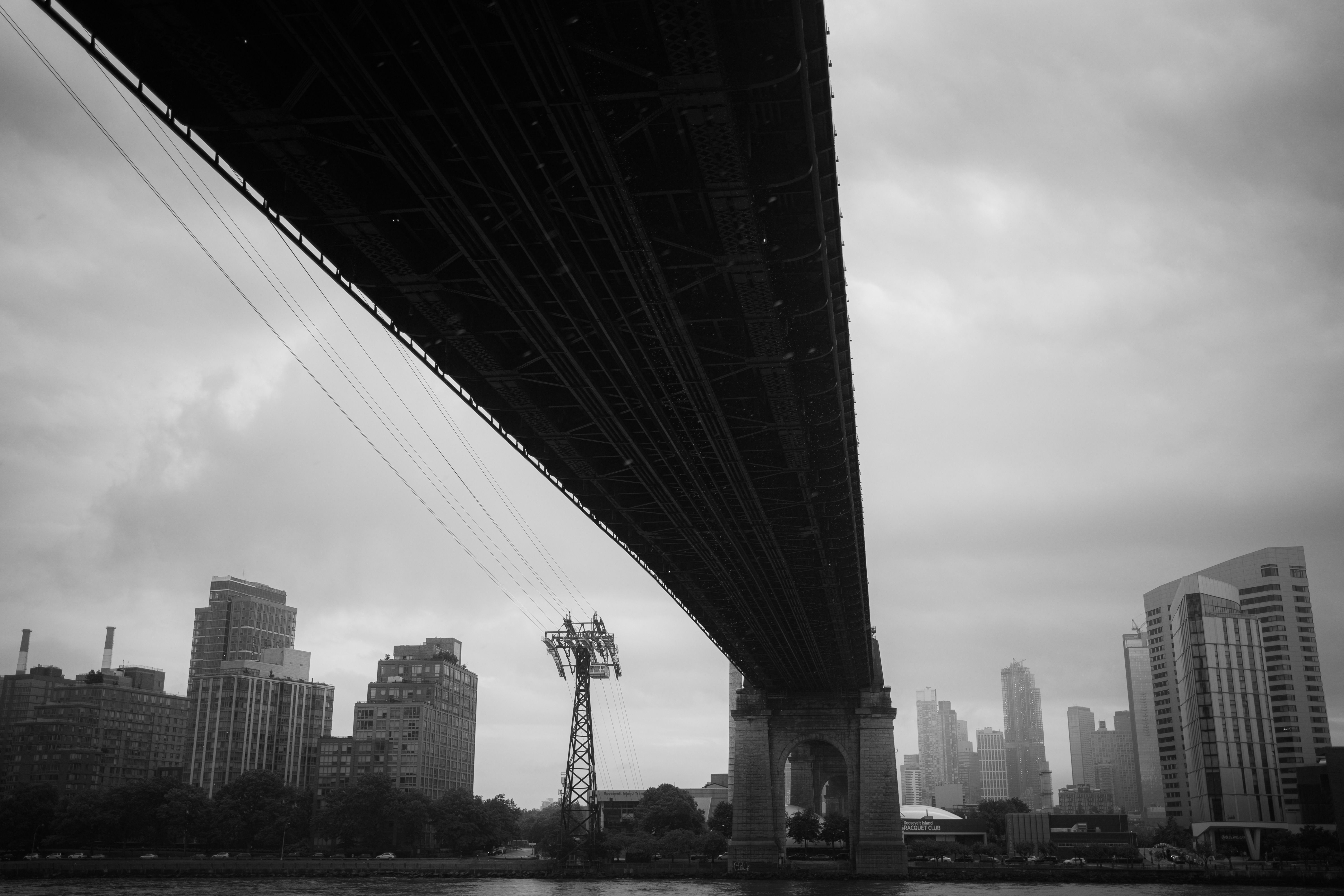 Bridge and Buildings in City in Black and White · Free Stock Photo