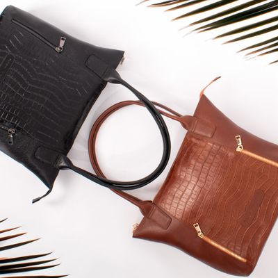 Leather bags arranged flat — José Martin Segura Benites on Pexels