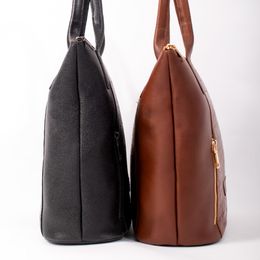 Black and brown leather handbags side by side — photo by Jos&eacute; Martin Segura Benites on Pexels