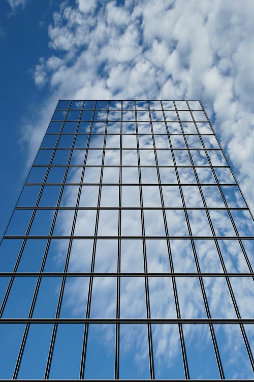 Free Low Angle Photography of Glass Building Stock Photo