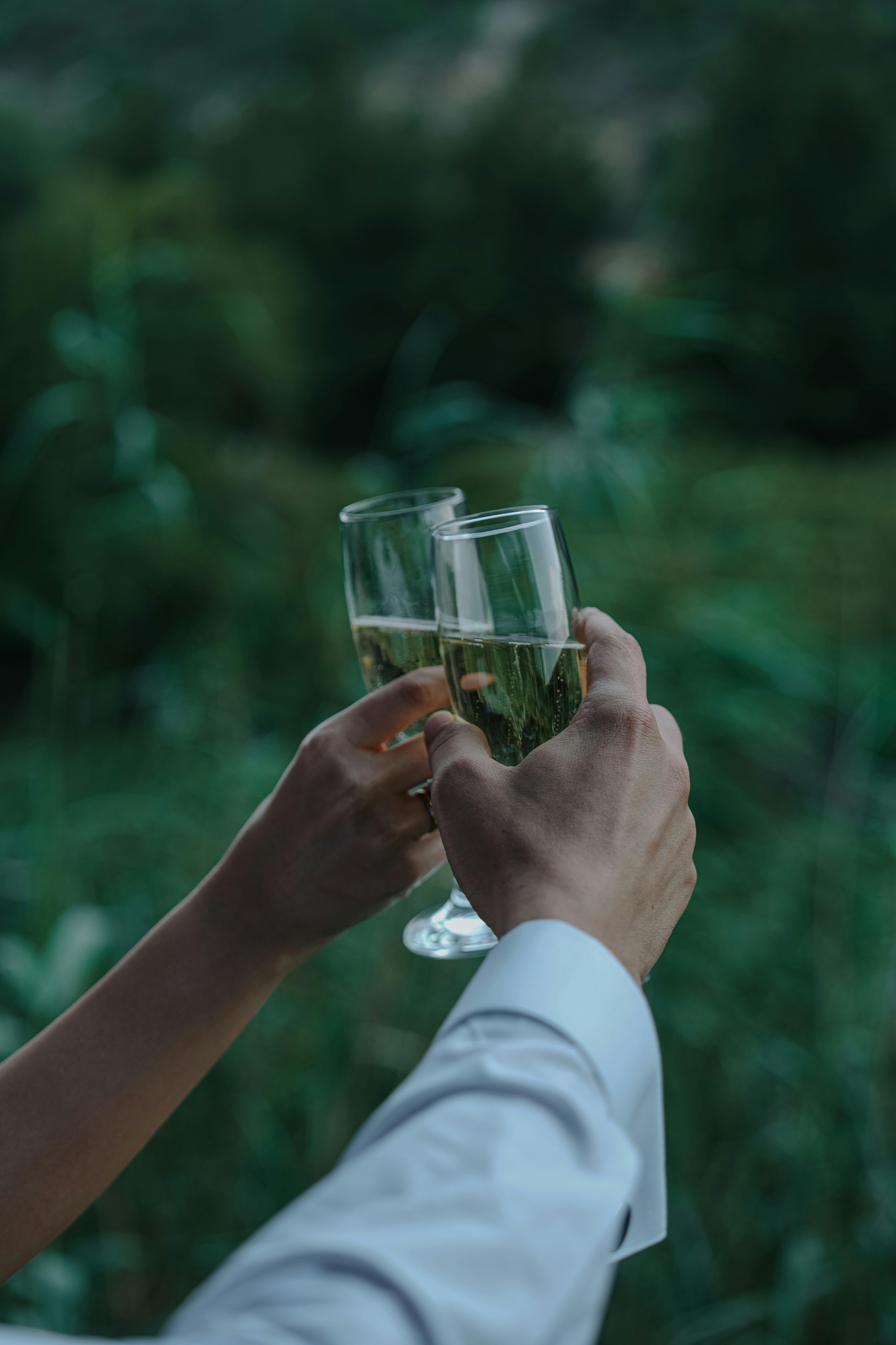 A couple holding whiskey glasses