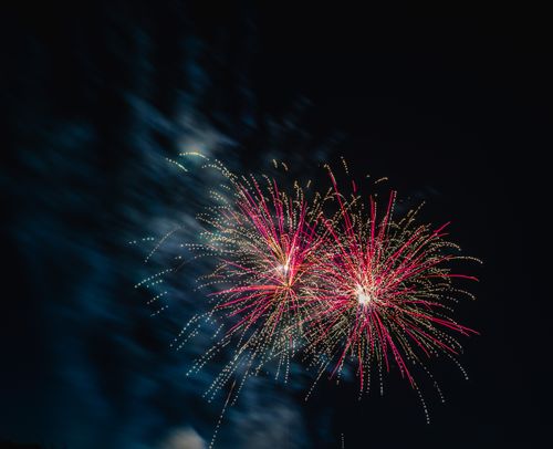 Free Vibrant fireworks illuminate the dark sky during a festive celebration. Stock Photo