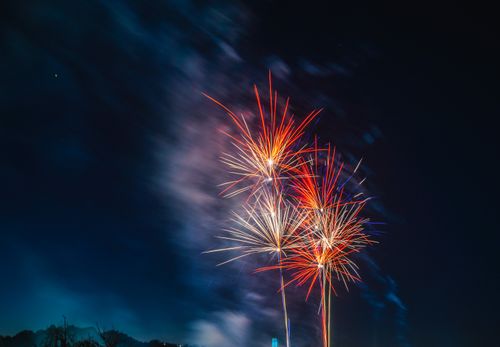 Free Colorful fireworks light up the night sky in a dazzling celebration. Stock Photo