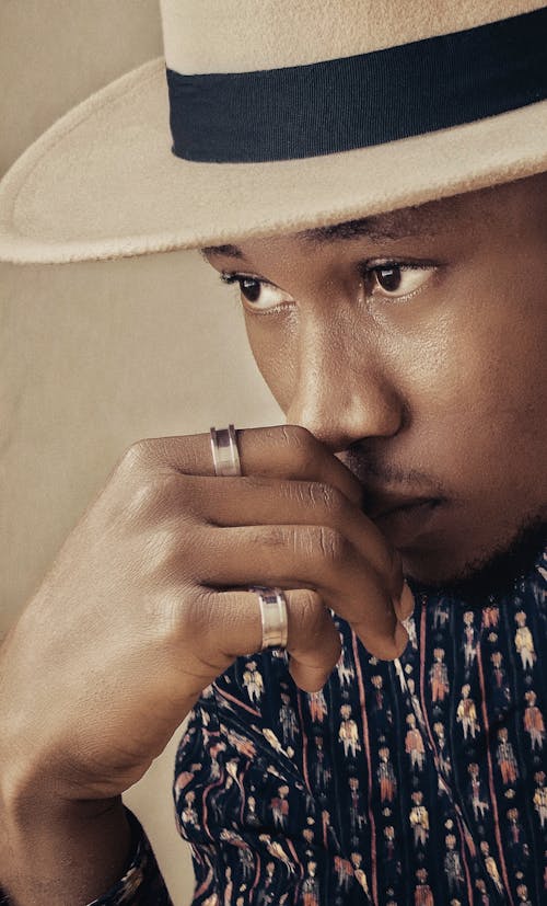 Close-Up Photo Of Man Wearing Fedora