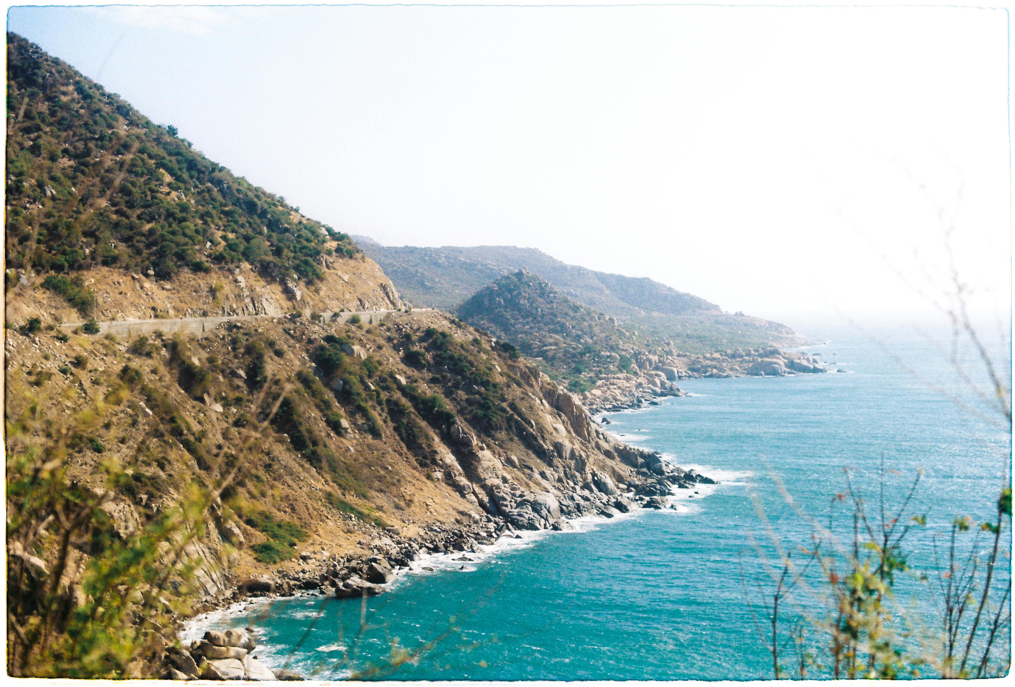 a scenic view of the ocean and a road