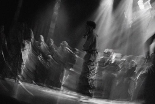 Blurred motion capture of a dance performance on stage in Jakarta, Indonesia.
