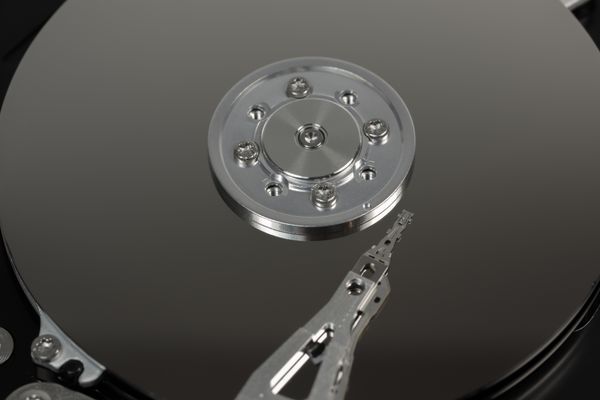 Macro view of a hard-drive platter and read arm — Pixabay on Pexels