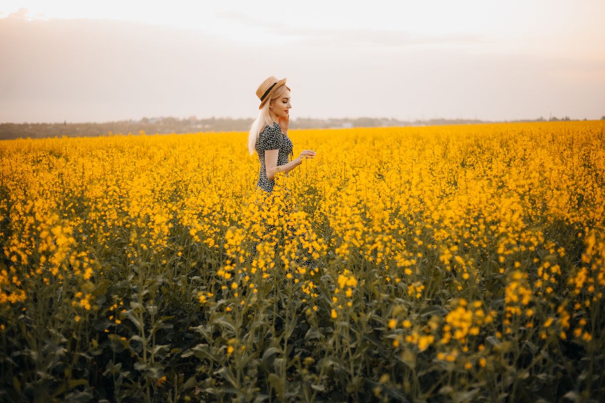 Woman Standing on Grass Field · Free Stock Photo