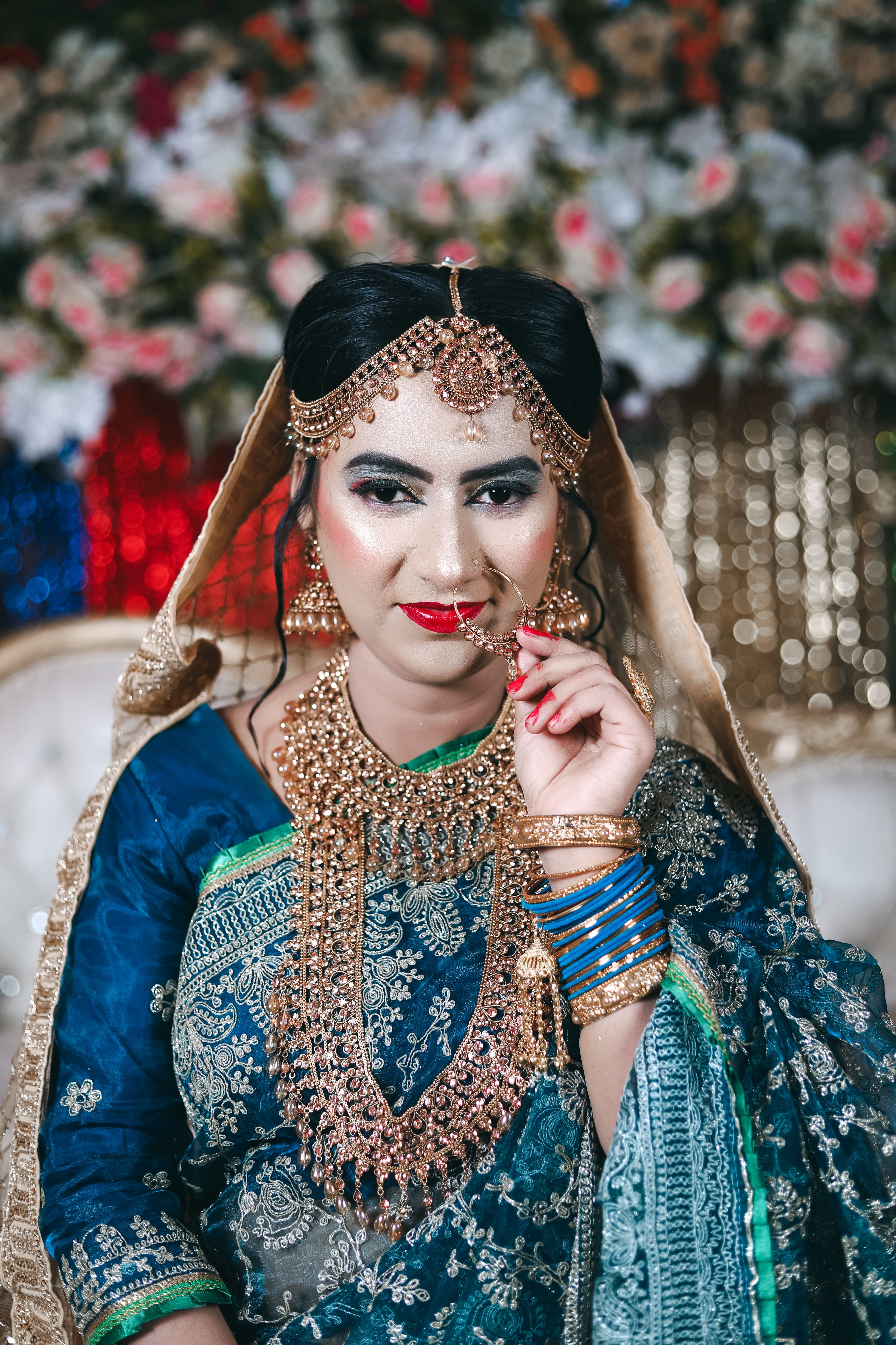 A beautiful indian bride in traditional attire · Free Stock Photo