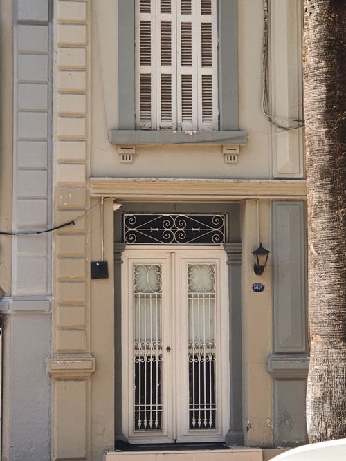 Free Elegant white door with intricate ironwork in Konak, İzmir, Türkiye. Stock Photo