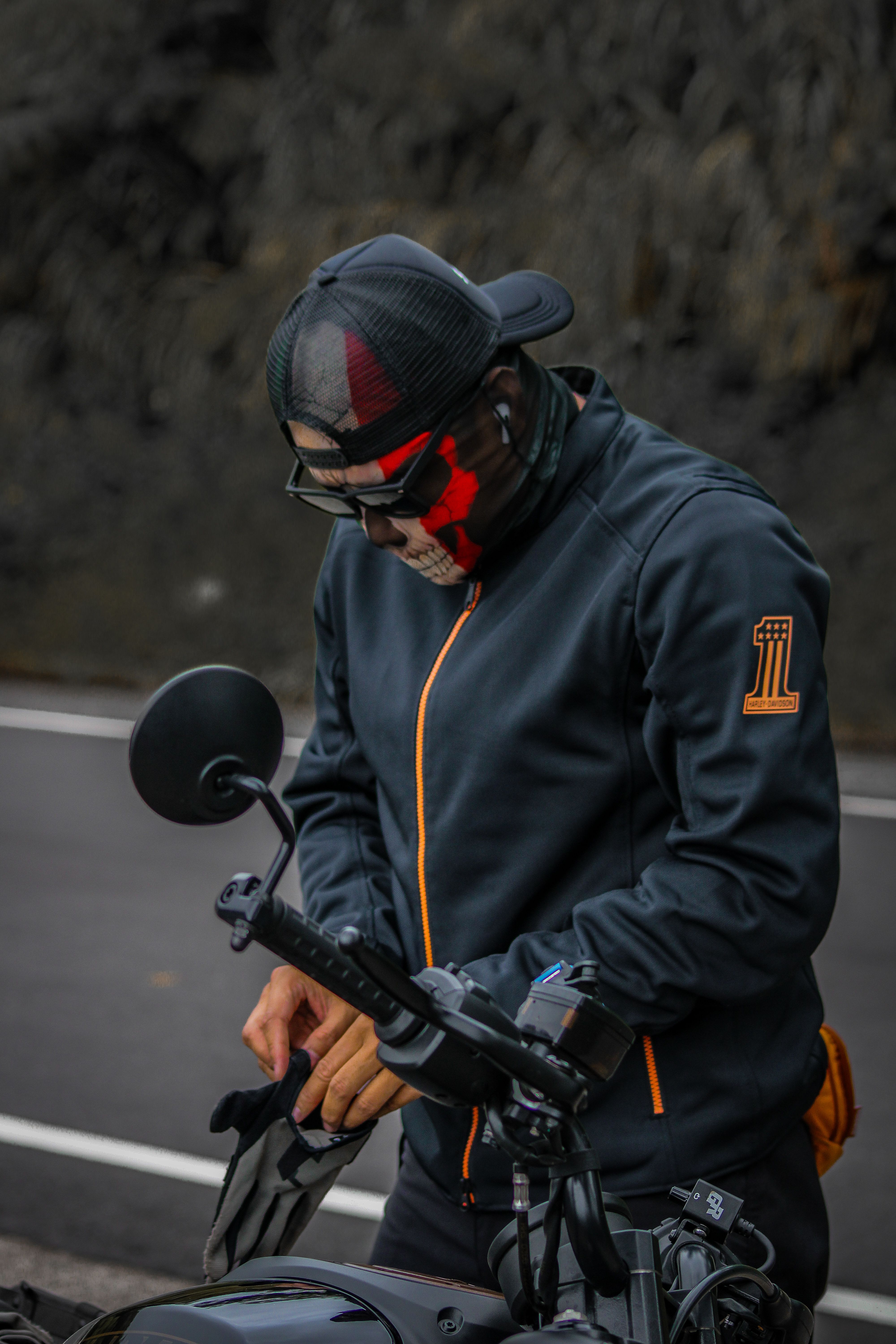 Man in Mask Standing with Motorcycle on Road · Free Stock Photo