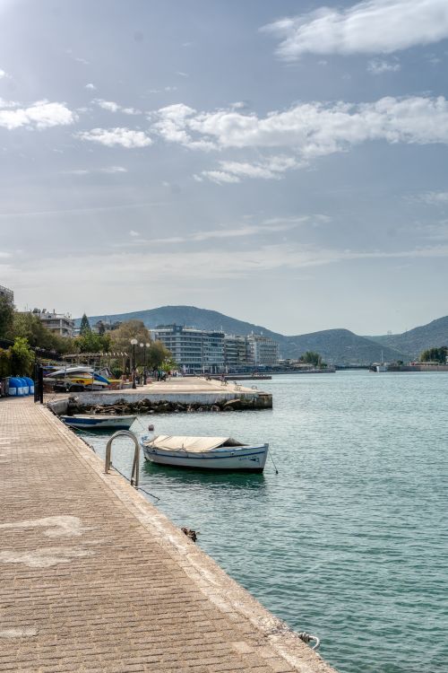 Free Discover the serene harbor of Chalkida, Greece, with boats and scenic views perfect for travel inspiration. Stock Photo