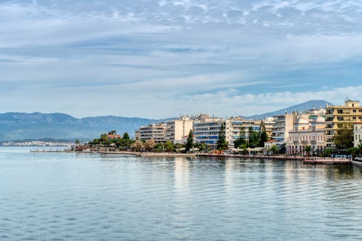 Charming waterfront cityscape of Chalkida, Greece, featuring picturesque buildings by the tranquil sea.