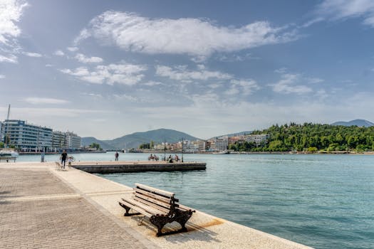 Scenic view of Chalkida's promenade with a bench and view of the sea.