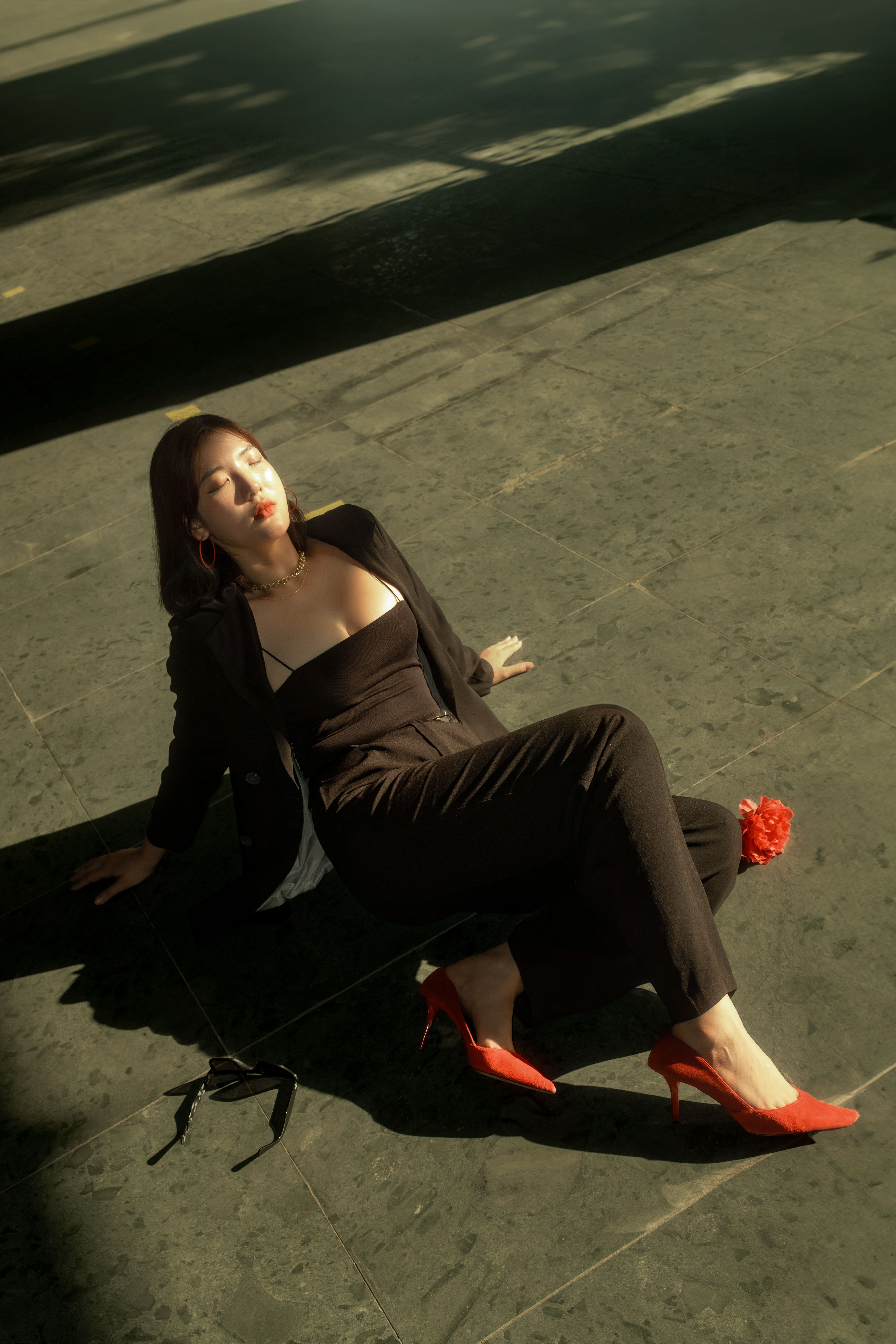 Woman Sitting on Ground with Eyes Closed · Free Stock Photo