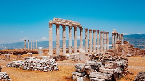Free Explore the ancient ruins of Laodicea, set against a clear blue sky in Pamukkale, Türkiye. Stock Photo