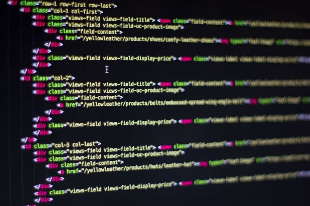Website code displayed on a monitor